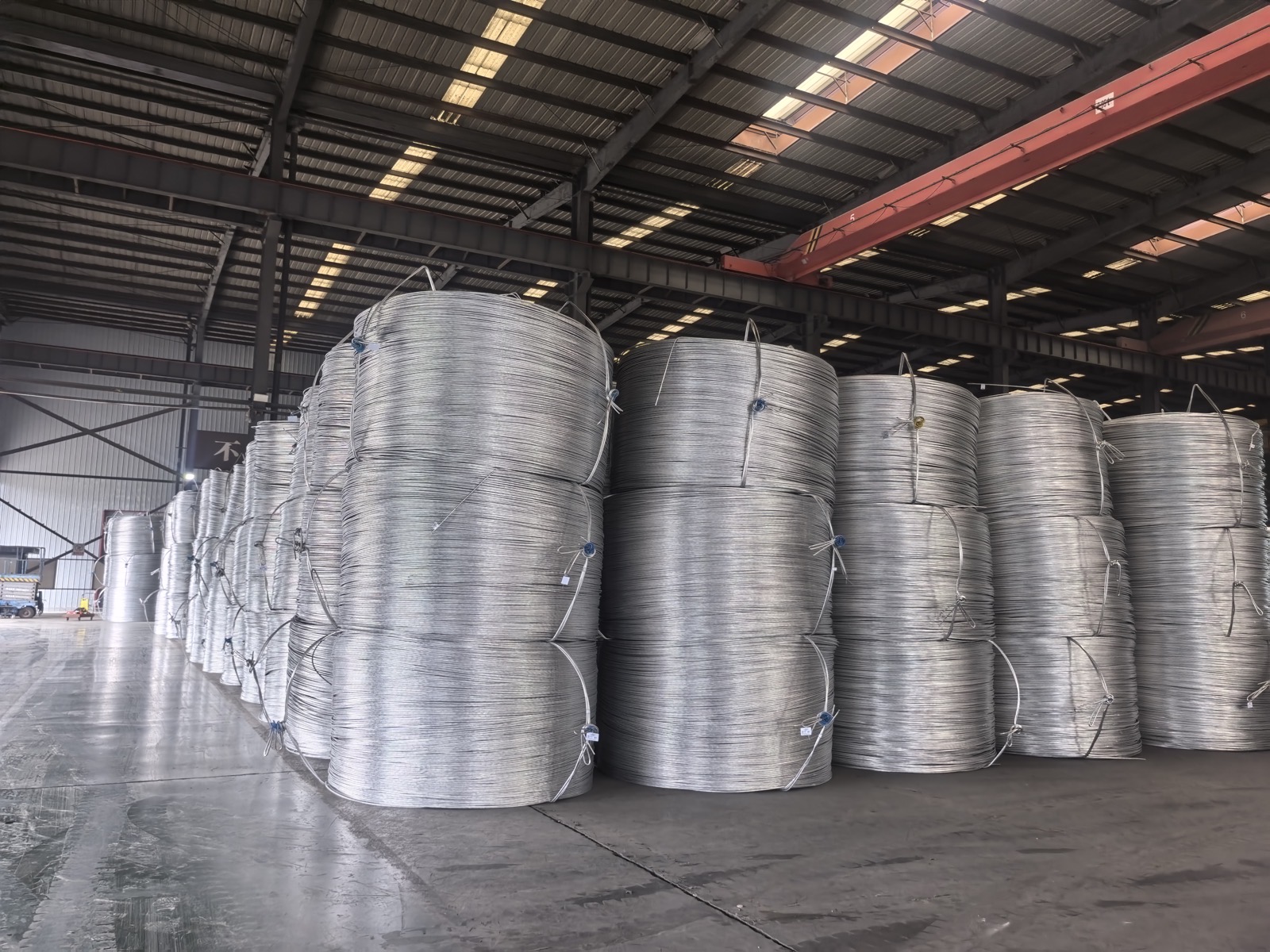 Warehouse with bundled coils of high-purity aluminium wire ready for shipment